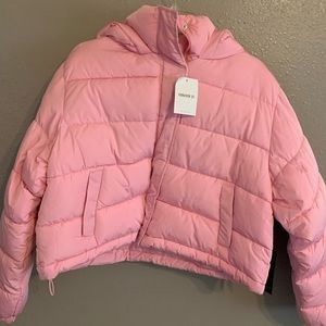 Pink bubble jacket, size large, new with tags, attached hood.